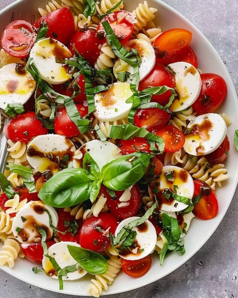 Delicious Caprese Pasta Salad with fresh tomatoes, mozzarella, and basil