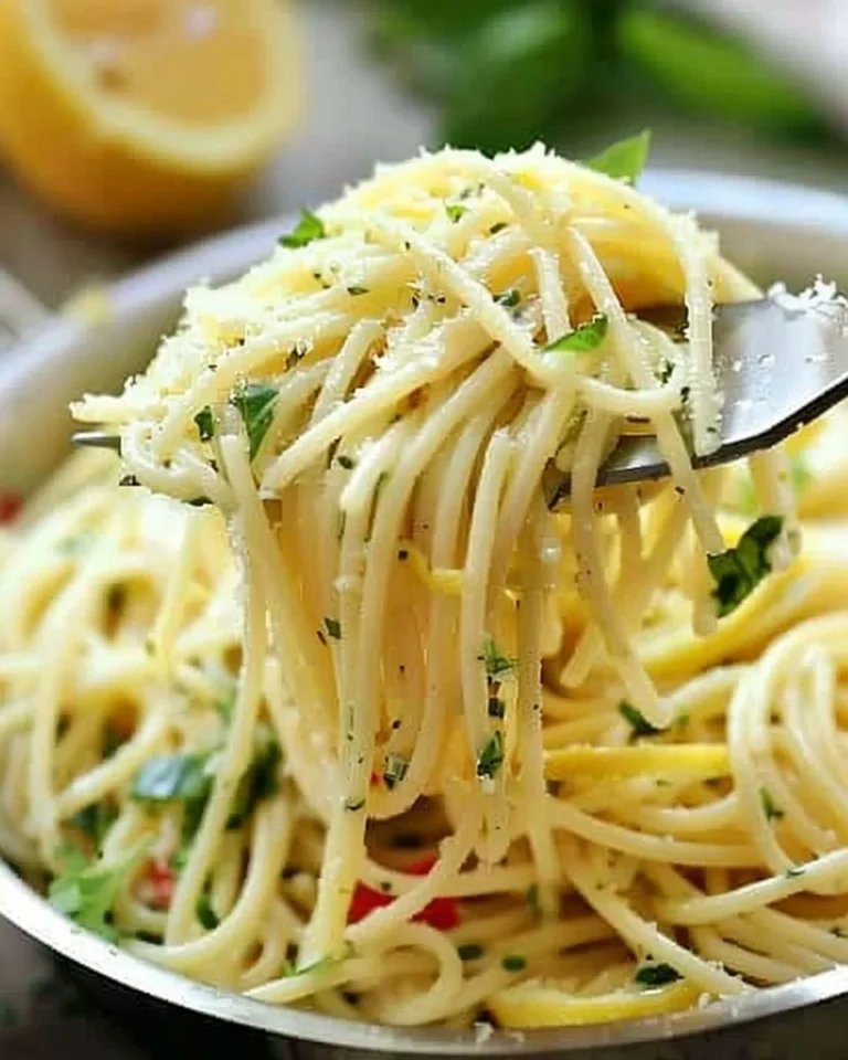 Delicious Lemon Basil Spaghetti garnished with fresh basil and lemon slices