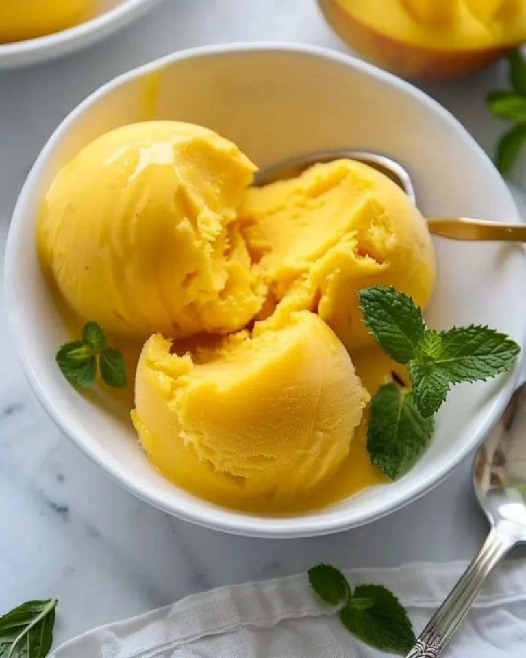 Delicious homemade no-churn mango sorbet served in a bowl