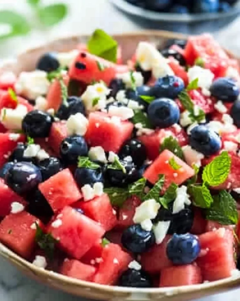 Delicious watermelon blueberry feta salad served in a bowl.