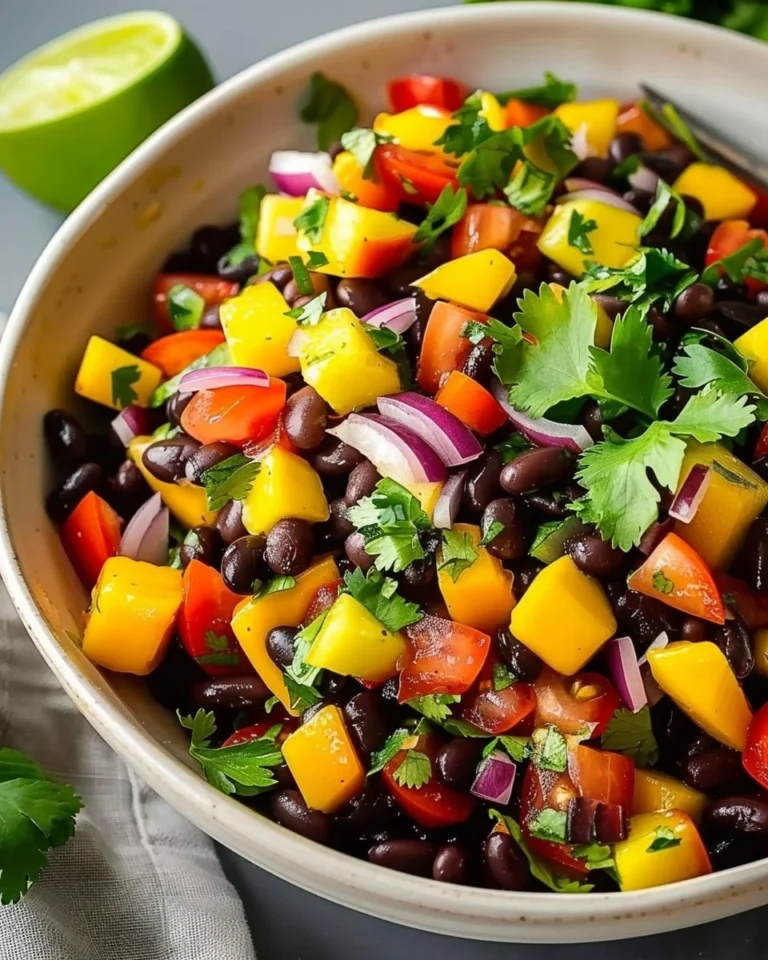 Colorful Mango Black Bean Salad with fresh ingredients served in a bowl